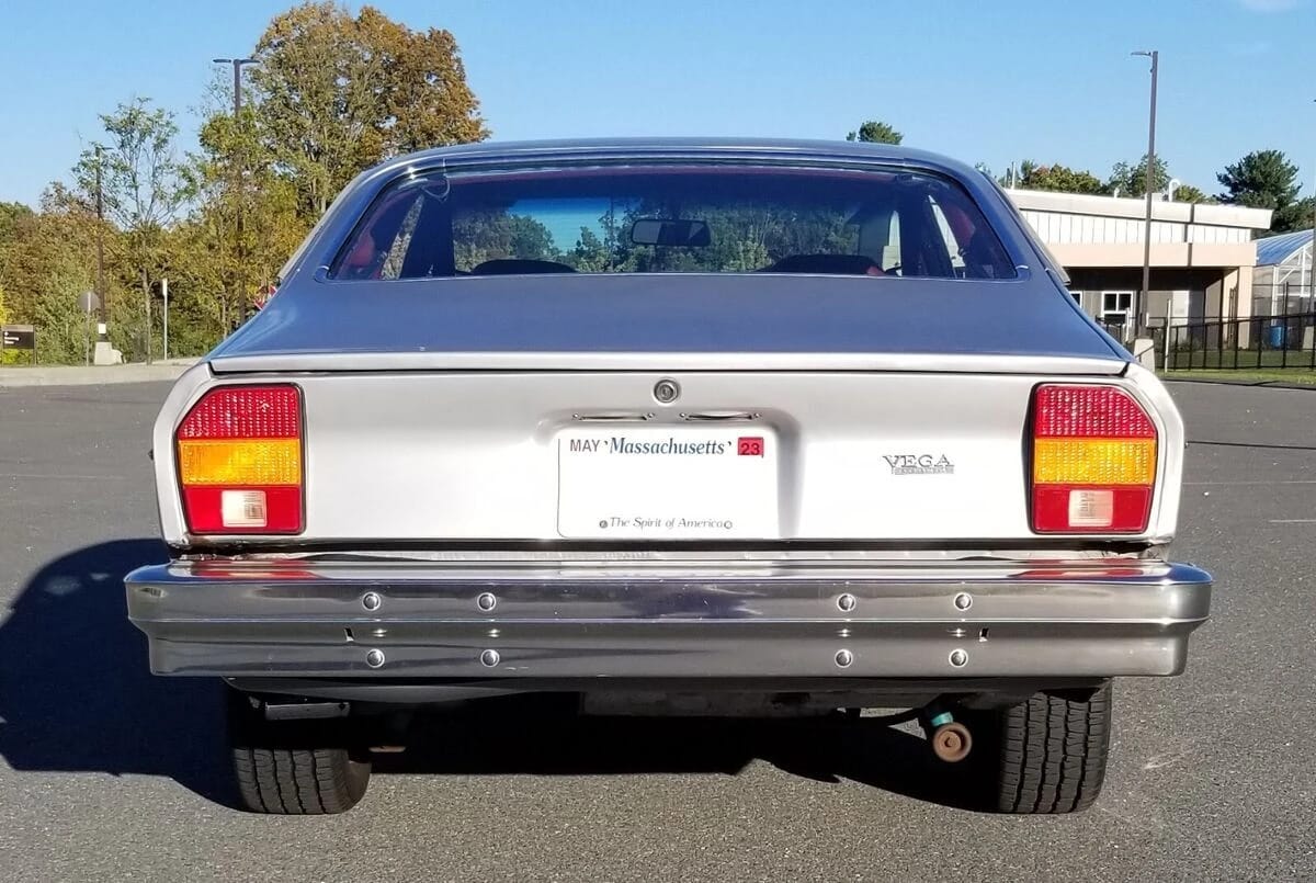 Rear view of a silver 1977 Chevrolet Vega three-door coupe