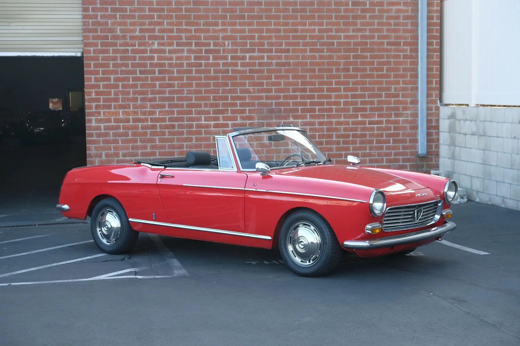 Pininfarina's Shared Language of Beauty in 1963—From Ferrari to FIAT 10 Picture of red Peugeot 404 Cabriolet in front of brick wall