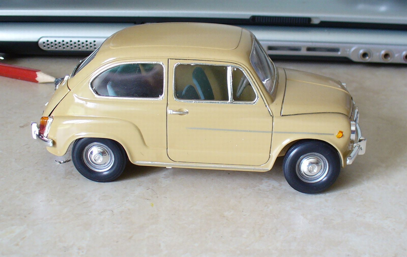 Small But Iconic: A Gallery Of Mini Car Models 1 Photo of scale model of a yellow Fiat 600