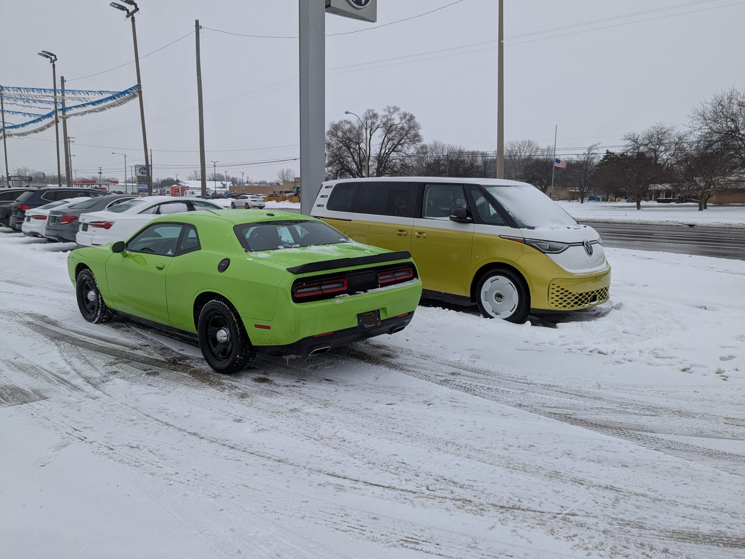 Picture of 2023 Dodge Challenger in front of Volkswagen ID. Buzz