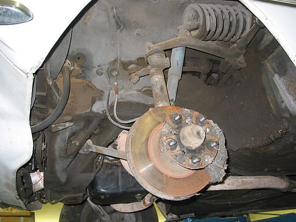 Photo of the left front suspension of a Rover 3500 (P6), including the front disc brake