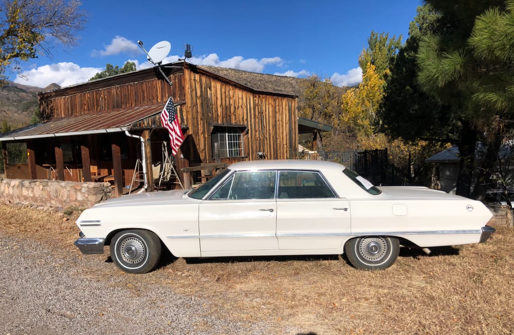 White 1963 Chevrolet Impala 4-door hardtop with V8, three speed manual and a/c