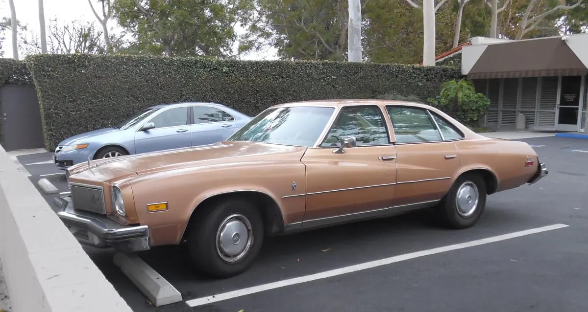 1975 Buick Century Regal: Rare Colonnade 4-Door Survivor 1 Photo of a metallic tan 1975 Buick Century Regal sedan in a parking lot