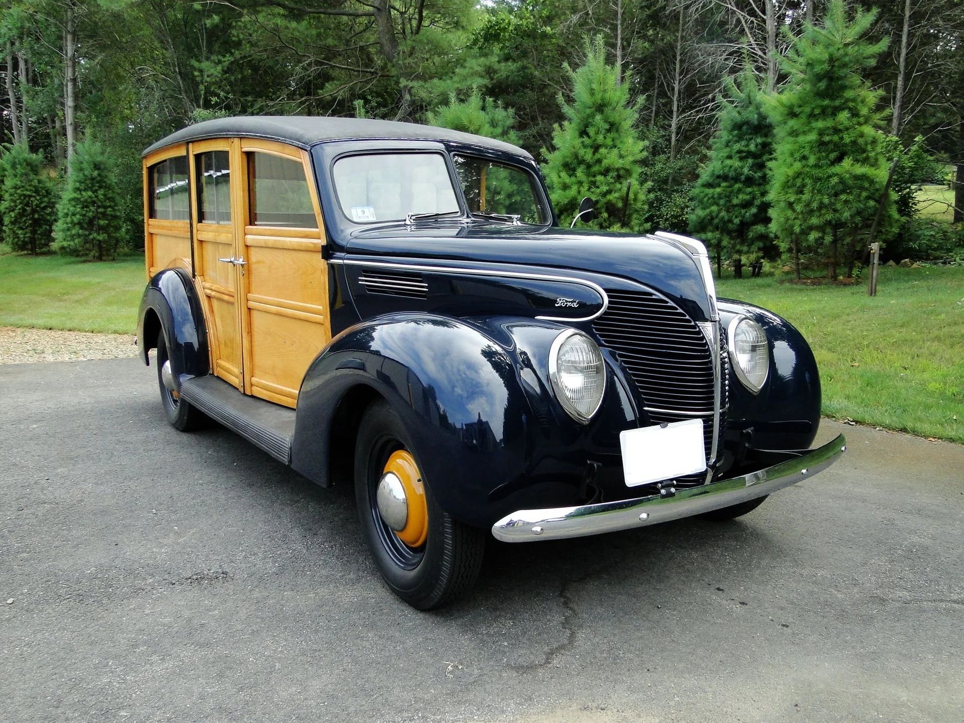 Right front 3q view of a dark blue 1939 Ford wood-bodied station wagon