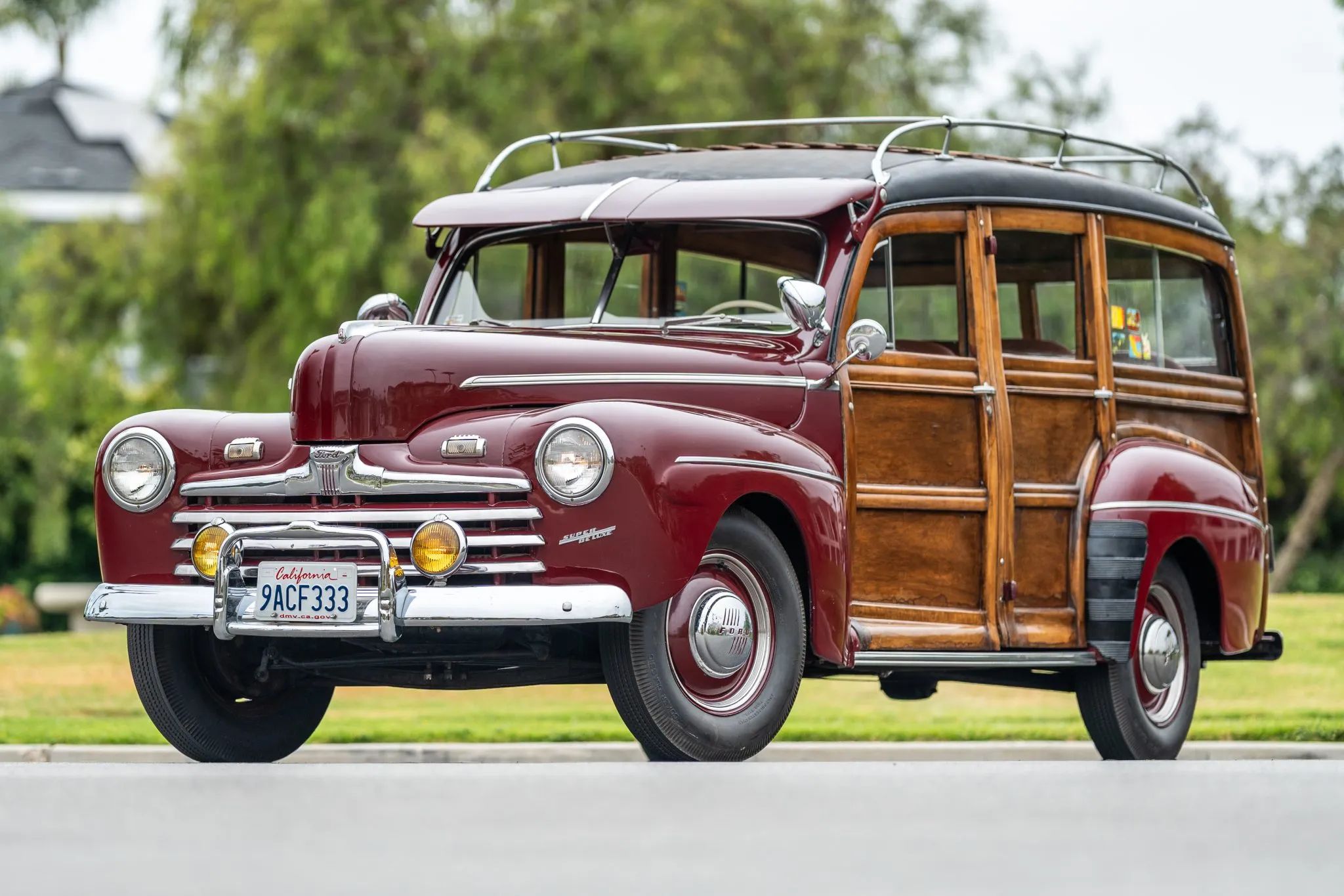 Left front 3q view of a maroon 1946 Ford wood-bodied station wagon