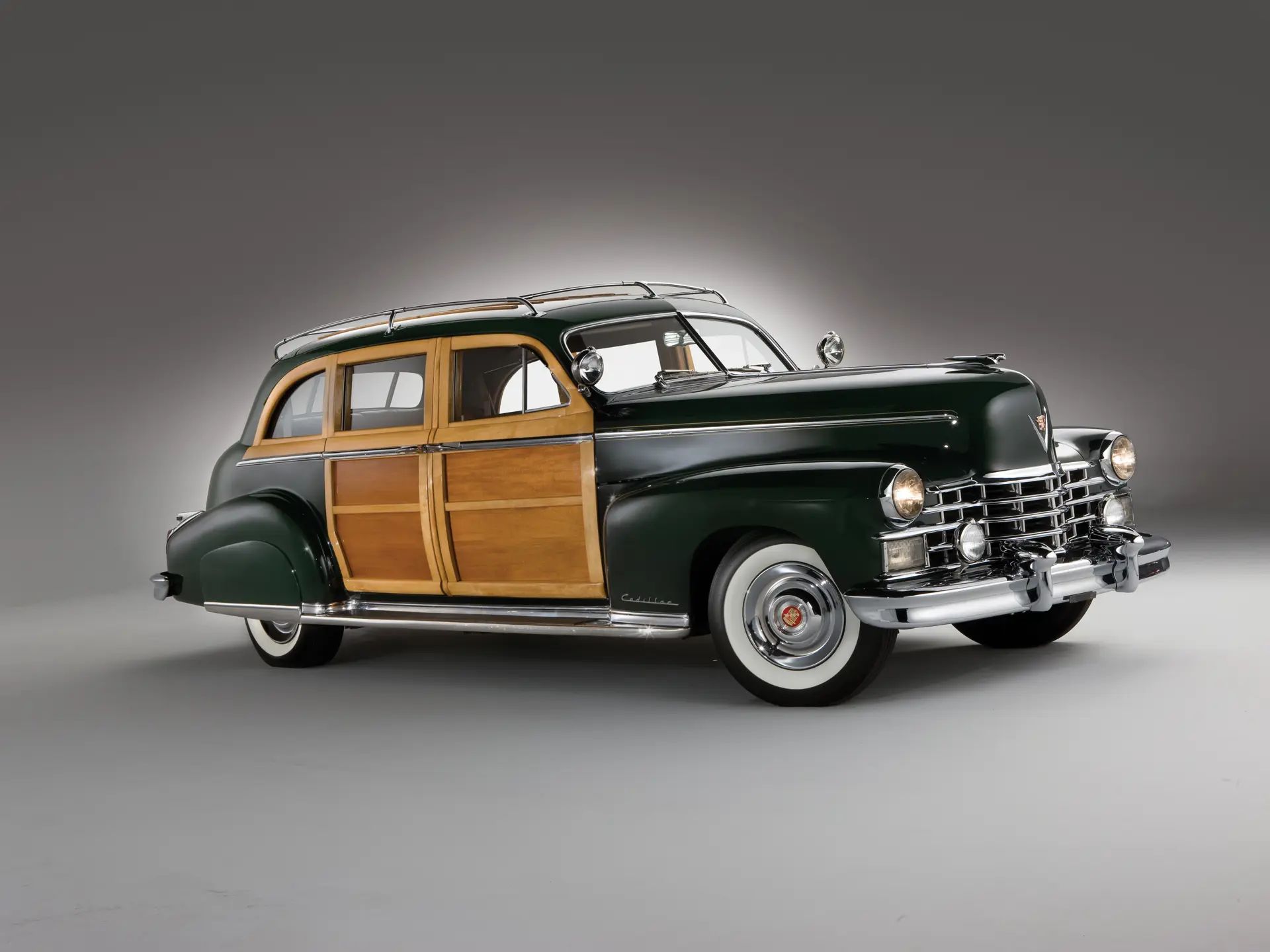 A Cadillac Woodie Sedan? This Wood-Paneled 1951 Cadillac Series 75 Was Once Owned By Gene Autry 6 Studio right front 3q view of a black 1949 Cadillac with wood doors and side window frames