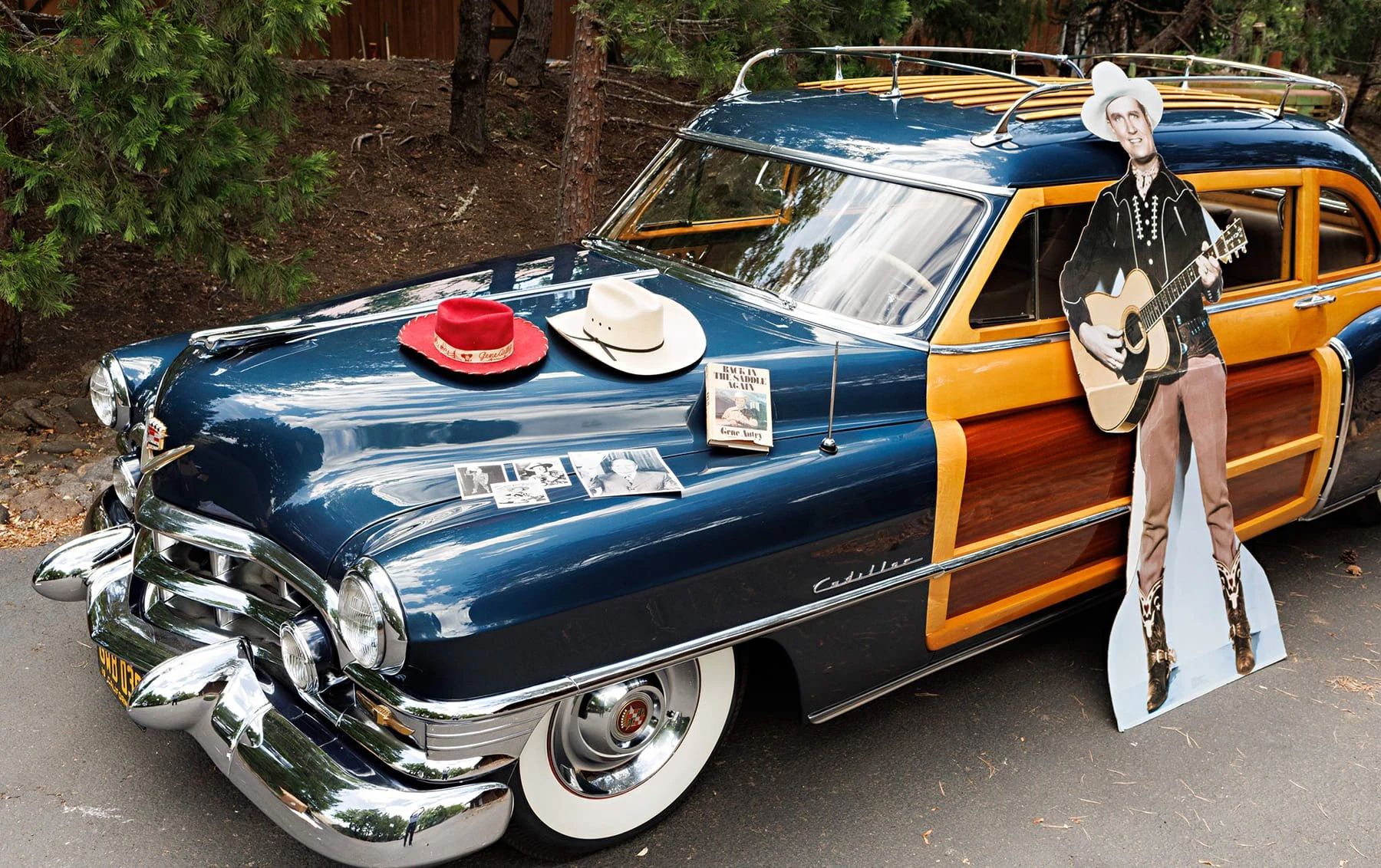 A Cadillac Woodie Sedan? This Wood-Paneled 1951 Cadillac Series 75 Was Once Owned By Gene Autry 13 Blue 1951 Cadillac Series 75 woodie with a Gene Autry cardboard standee leaning against the door and Autry memorability spread out on the hood
