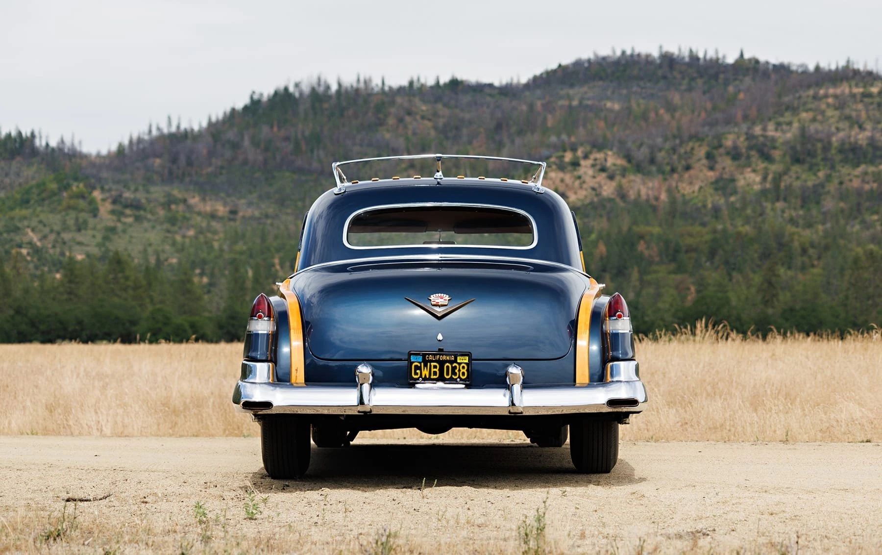 A Cadillac Woodie Sedan? This Wood-Paneled 1951 Cadillac Series 75 Was Once Owned By Gene Autry 19 Rear view of a blue 1951 Series 75 with wood trim in the rear fenders