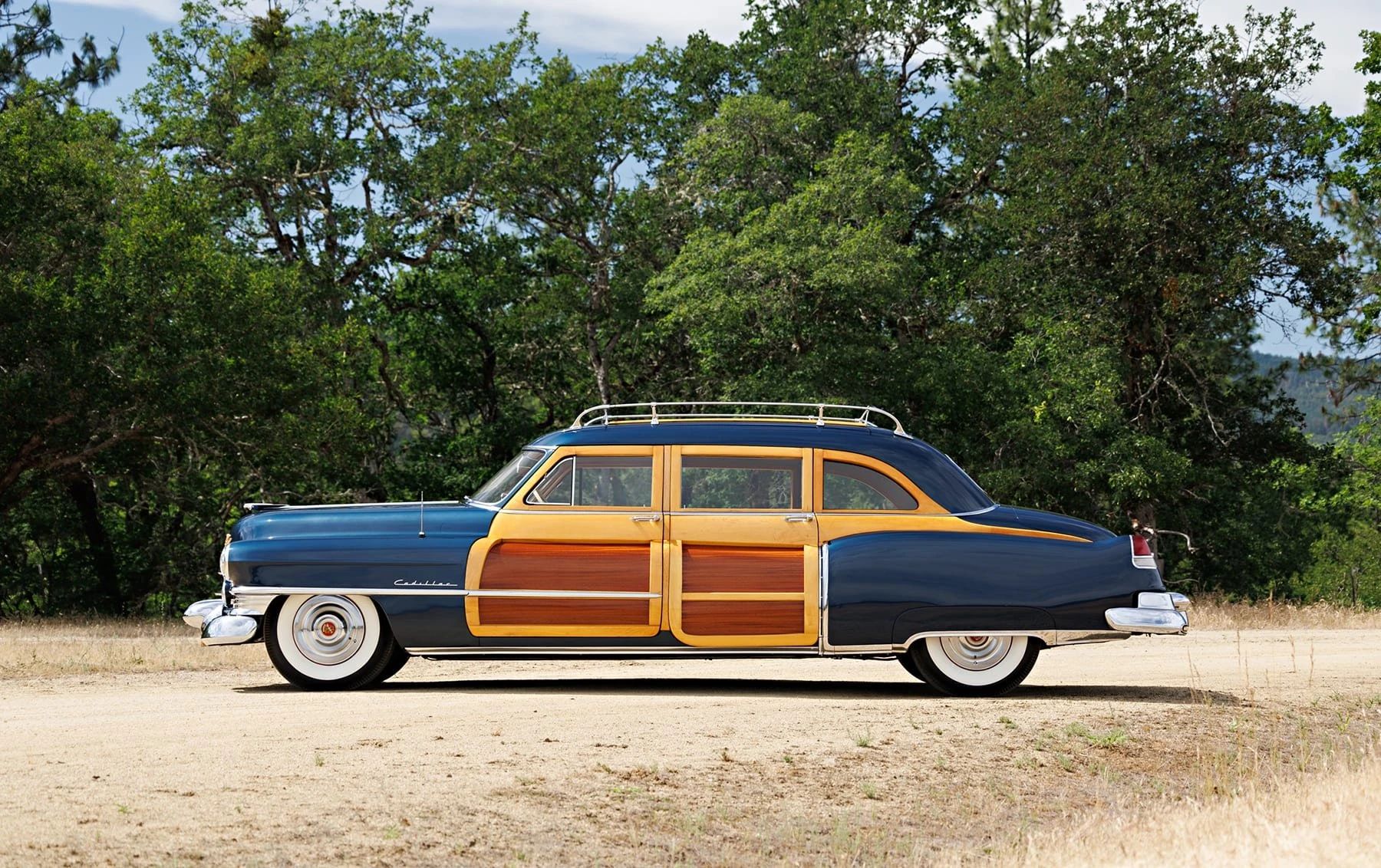 A Cadillac Woodie Sedan? This Wood-Paneled 1951 Cadillac Series 75 Was Once Owned By Gene Autry 7 Left side view of a blue 1951 Series 75 with wood doors and side window frames