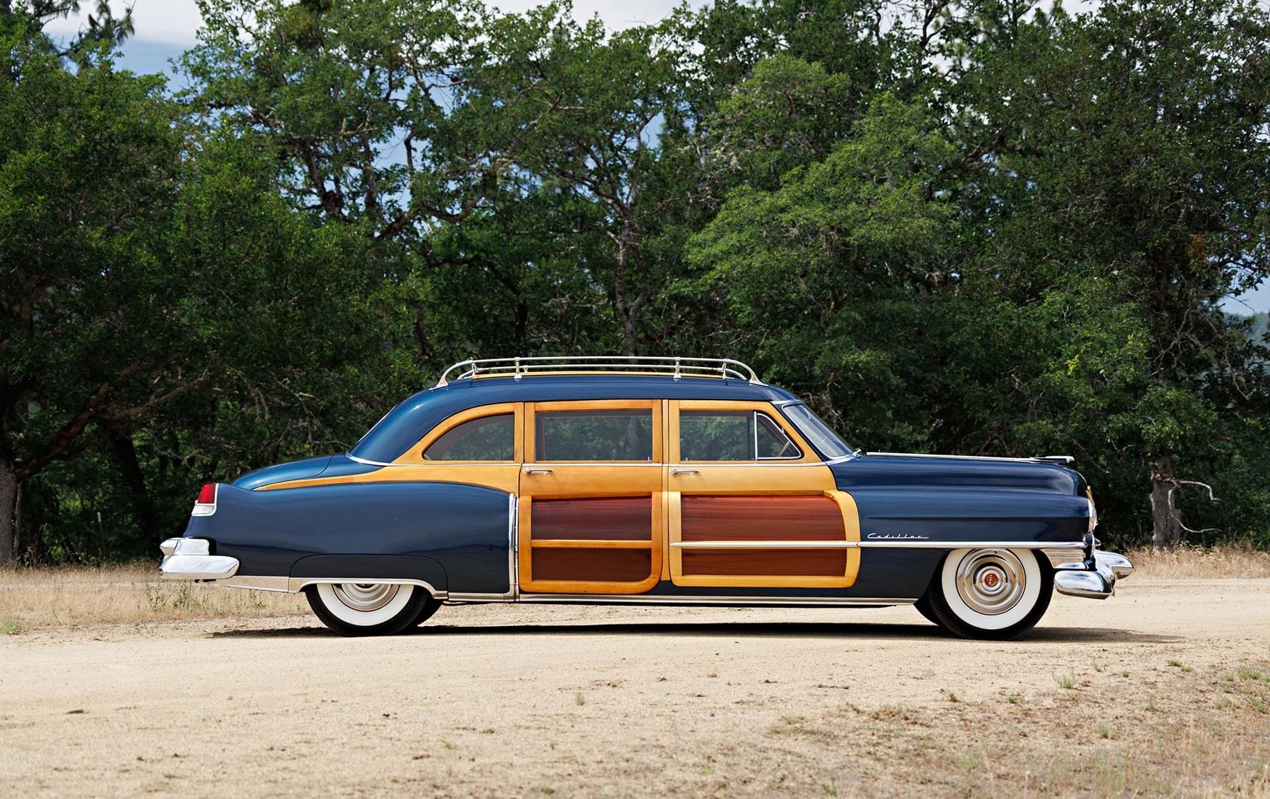 A Cadillac Woodie Sedan? This Wood-Paneled 1951 Cadillac Series 75 Was Once Owned By Gene Autry 16 Right side view of a blue 1951 Series 75 with wood doors and side window frames