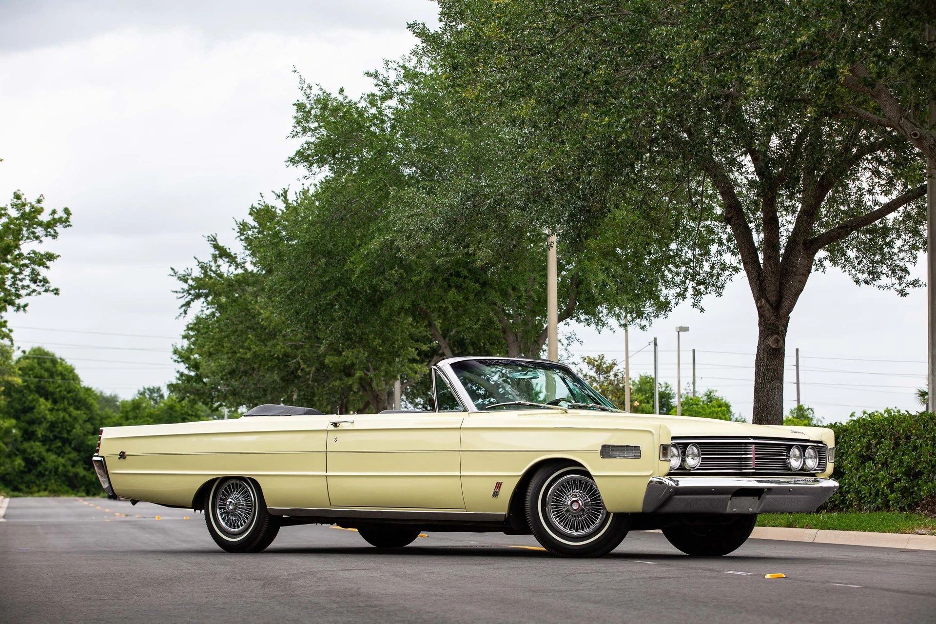 Right front 3q view of a yellow 1966 Mercury convertible with the top down
