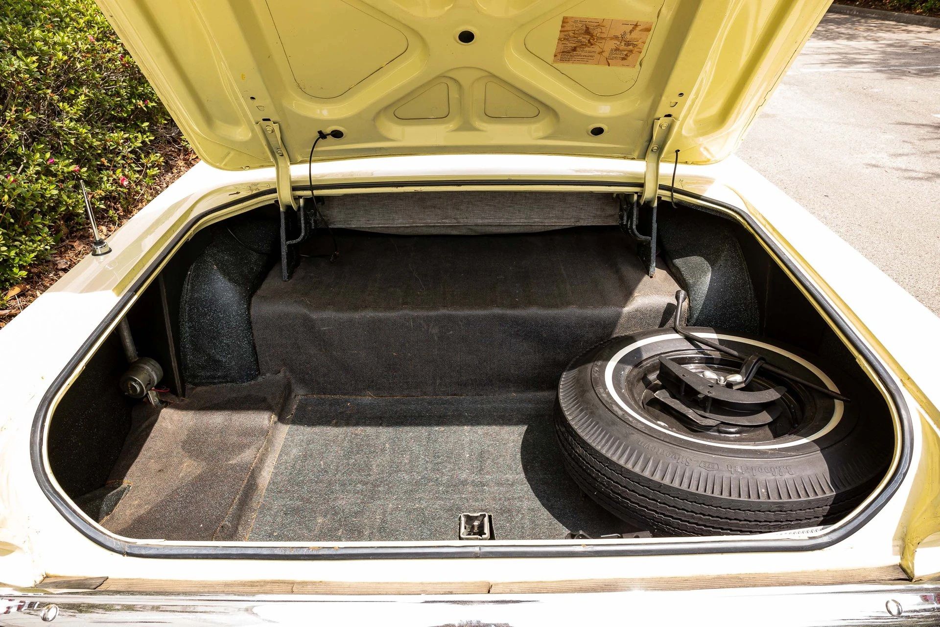 Trunk of a yellow 1966 Mercury