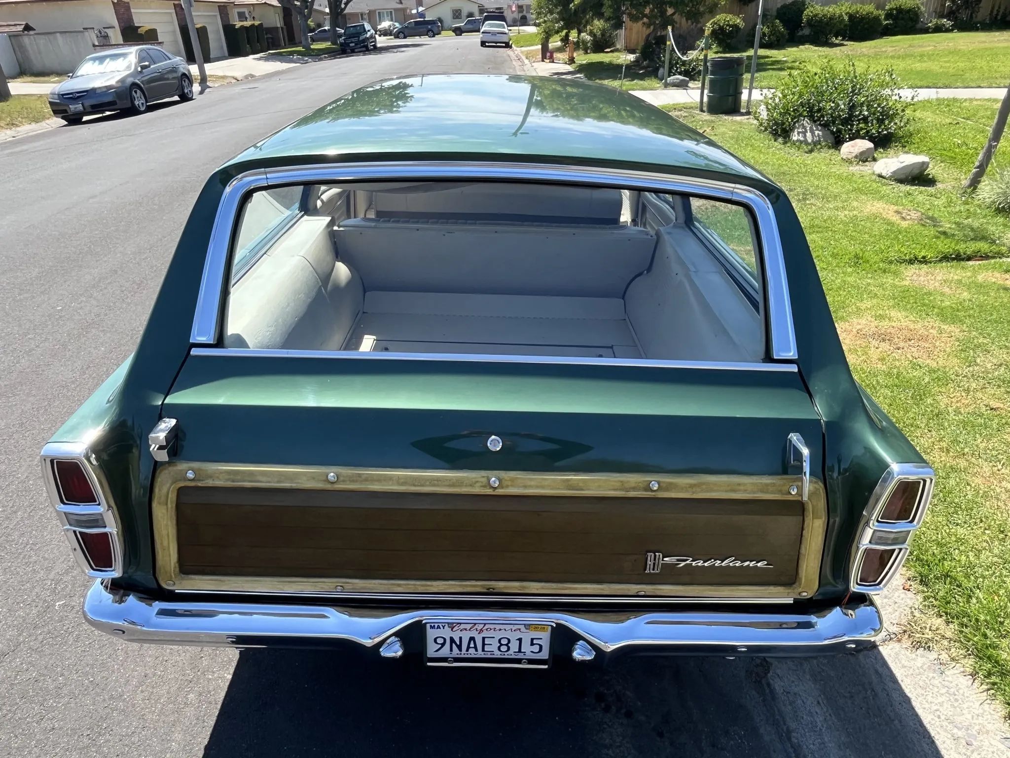 1967 Ford Fairlane Squire 3-Speed: Rare Midsize Stick-Shift Faux Woodie Wagon, But Why Did It Sell For $20K? 5 Rear view of a 1967 Fairlane Squire with fake wood trim