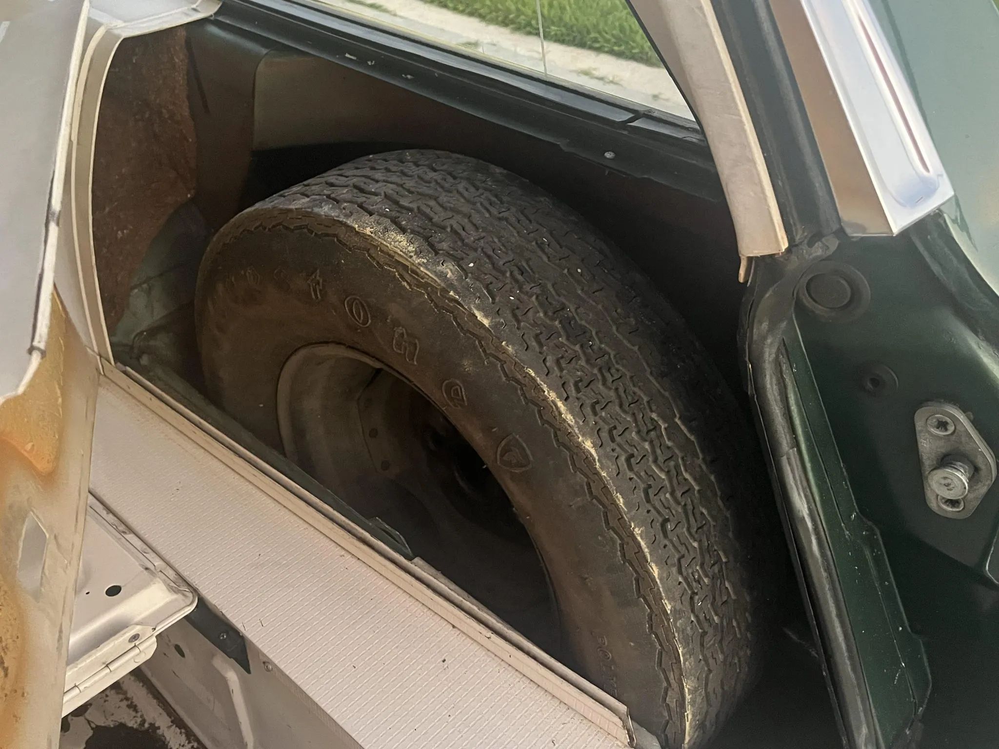 1967 Ford Fairlane Squire 3-Speed: Rare Midsize Stick-Shift Faux Woodie Wagon, But Why Did It Sell For $20K? 9 Spare tire in its compartment in the right side of a 1967 Fairlane wagon