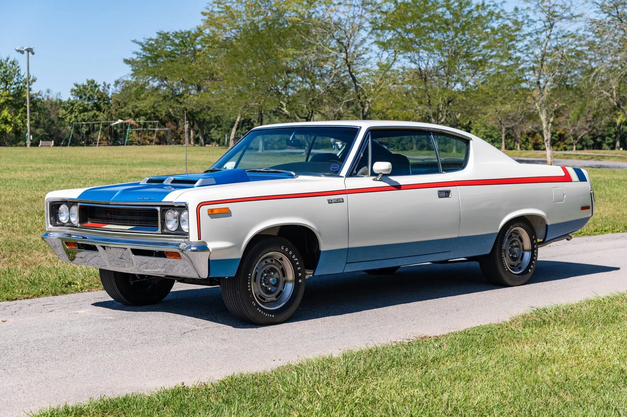 What Really Killed Muscle Cars In The '70s - Two Vintage Articles Try To Explain: "The Insurance Squeeze" And "What Price Muscle" 18 Left front 3q view of a white, blue, and red 1970 AMC Rebel