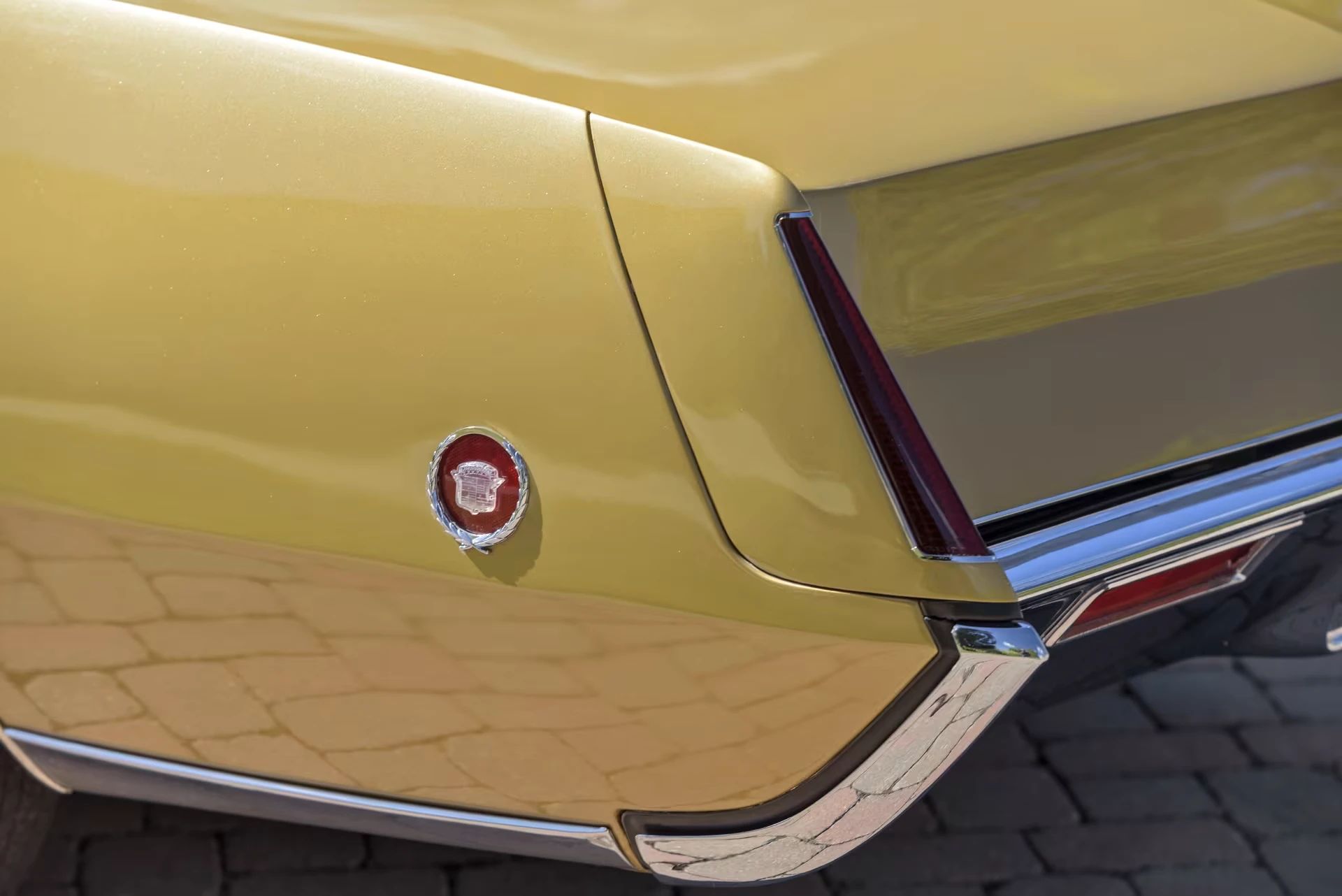 Vintage C/D Review: 1970 Cadillac Eldorado Was Powerful, Pricey, and Prestigious – So, Why Did They Photograph It Outside A Check-Cashing Place? 8 Left rear fender and taillight of a gold 1970 Eldorado