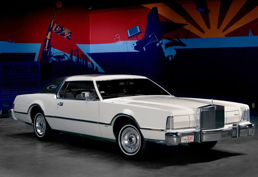 White 1975 Lincoln Continental Mark IV in a museum setting