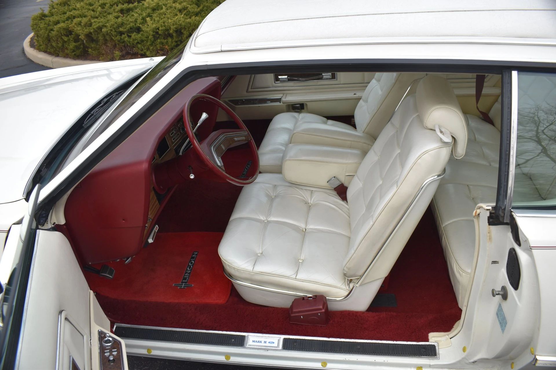 Front seats and red dashboard of a 1975 Mark IV
