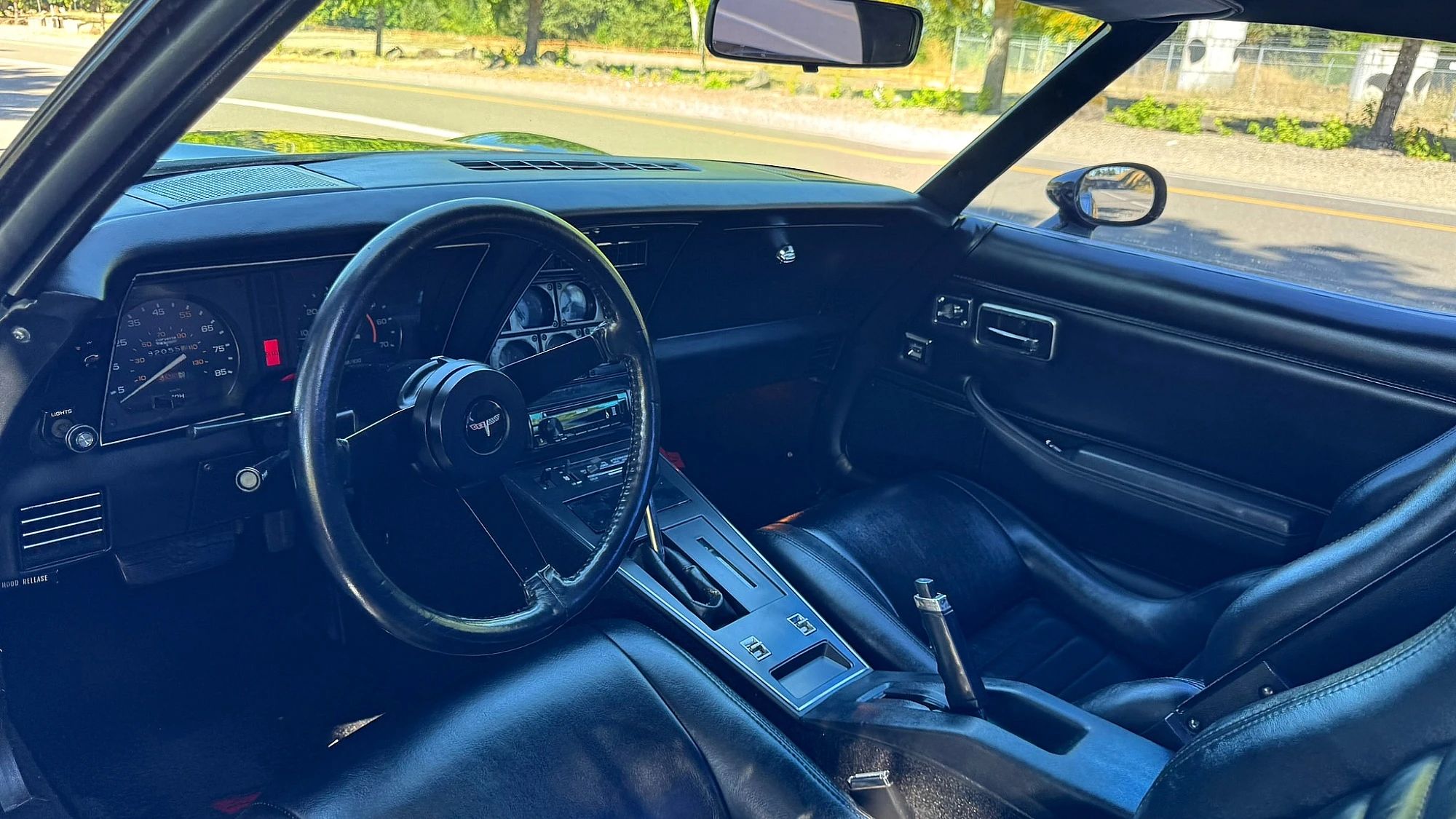 Interior of a 1980 Corvette with black leather upholstery