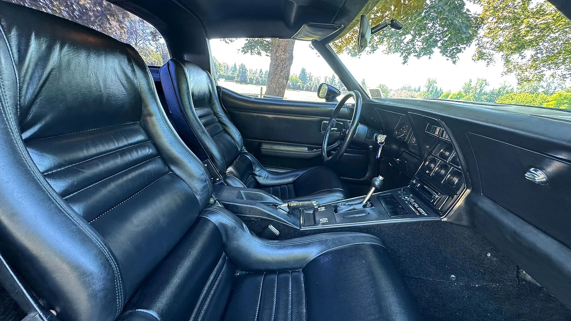 Interior of a 1980 Corvette with black leather upholstery