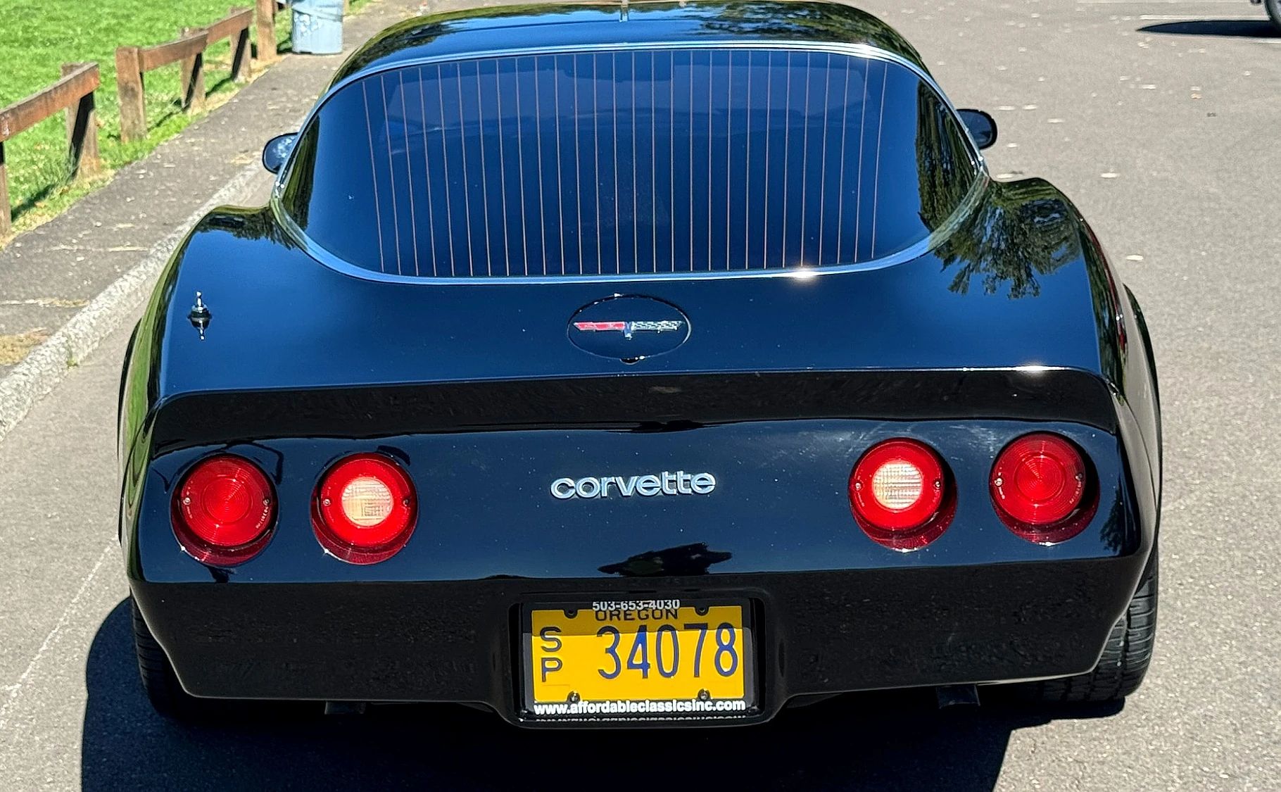 Rear view of a black 1980 Corvette
