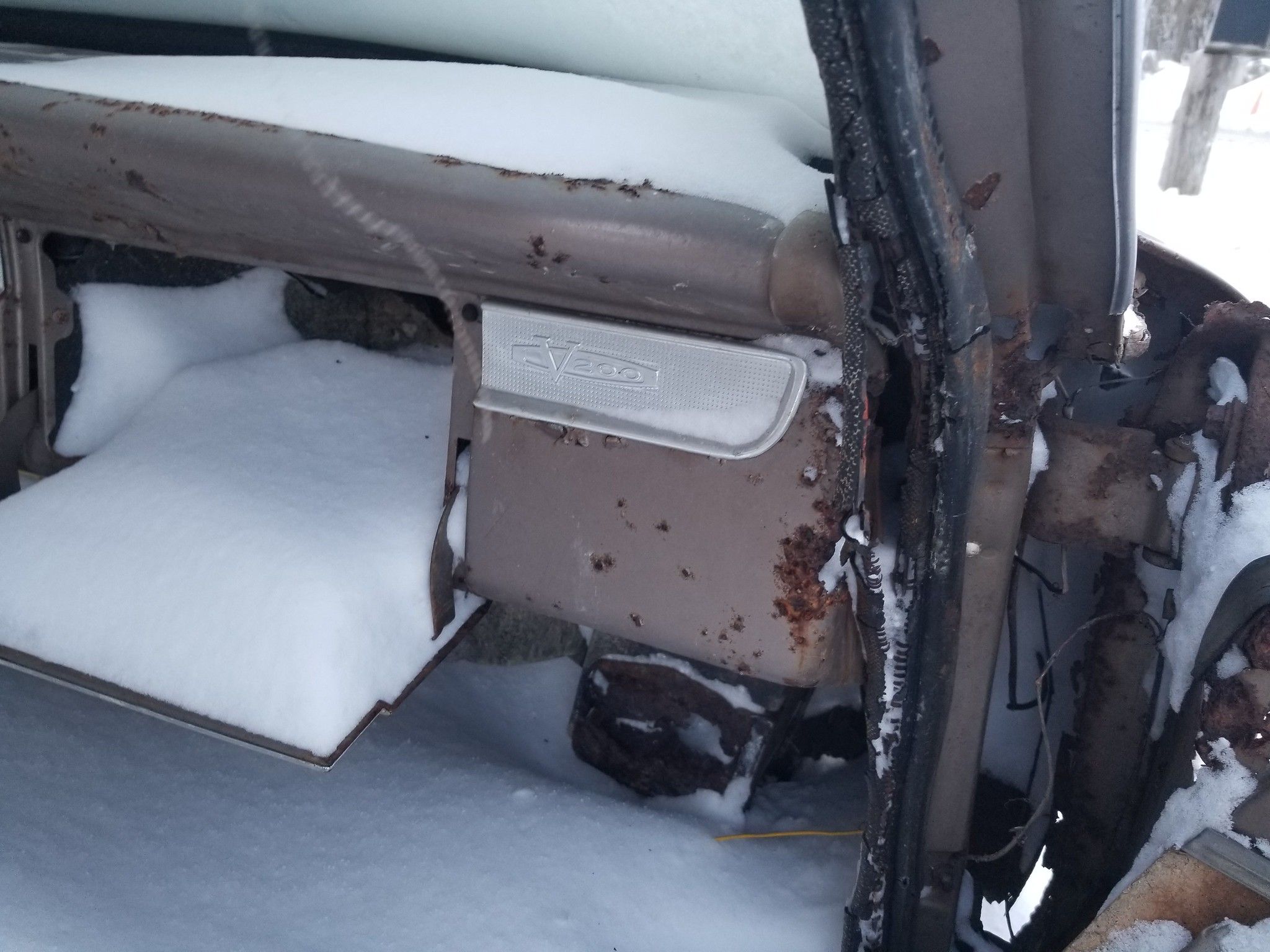 1963 Plymouth Valiant V-200 Sedan: A Snowblind Mopar, Dyin' Slow 2 Picture of 1963 Plymouth Valiant V-200 dashboard, speckled with rust, with a crusty mound of snow on top