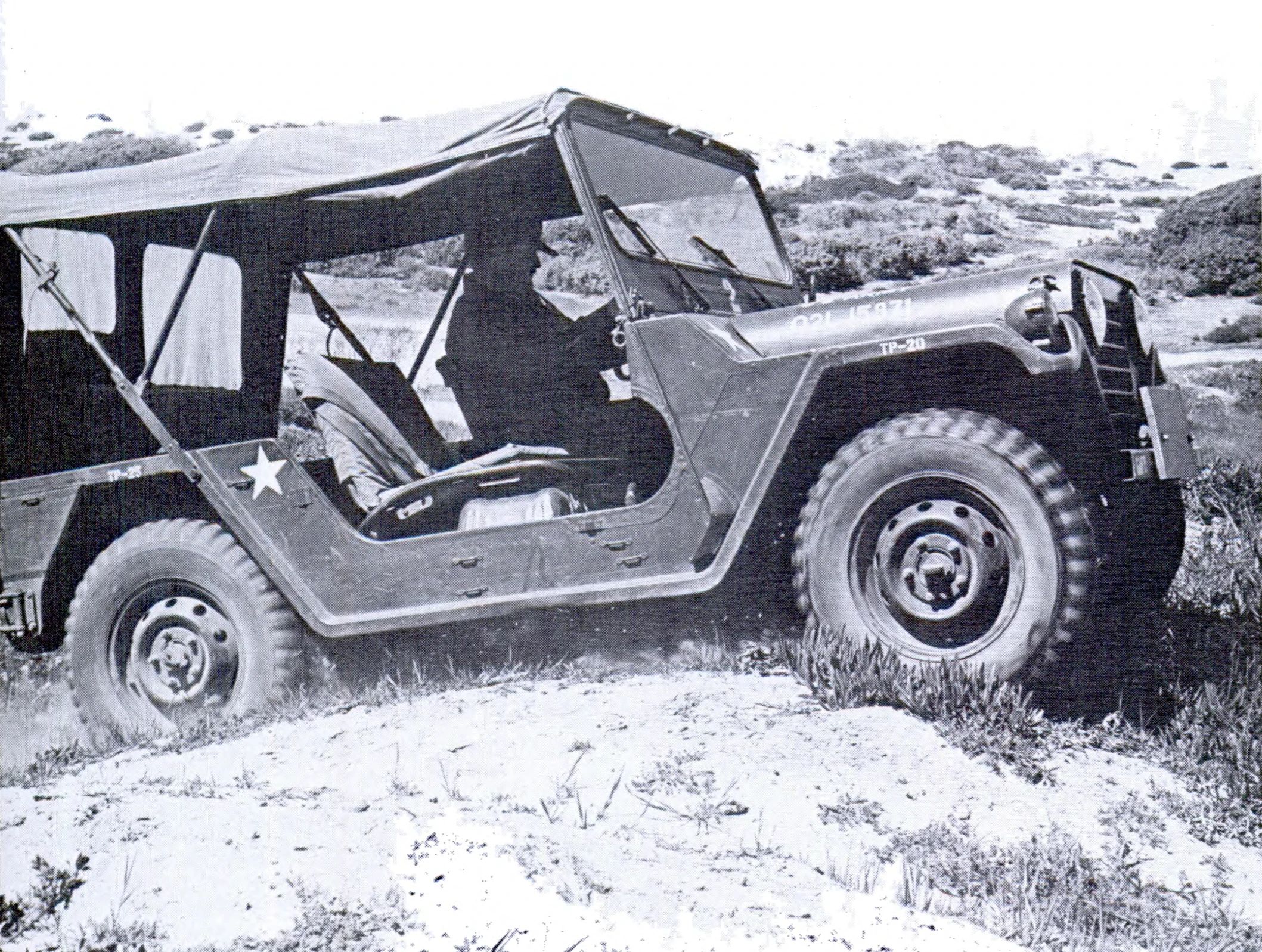 Ford M151 1/4-Ton Utility Truck: Why The Suspension Of The Military's Jeep Successor Made It Too Dangerous For Civilians 8 B&W photo of an M151A1 cresting a hill