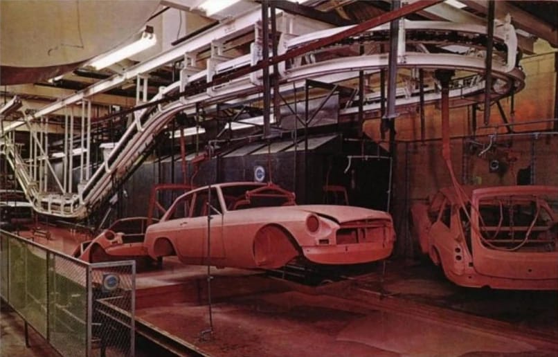 Electrocoating: How Ford Revolutionized Auto Painting, Why It Took Detroit 20 Years To Get Onboard, And Why It Didn't Stop '70s Rust 20 Color photo of an MGB GT emerging from an electrocoating tank