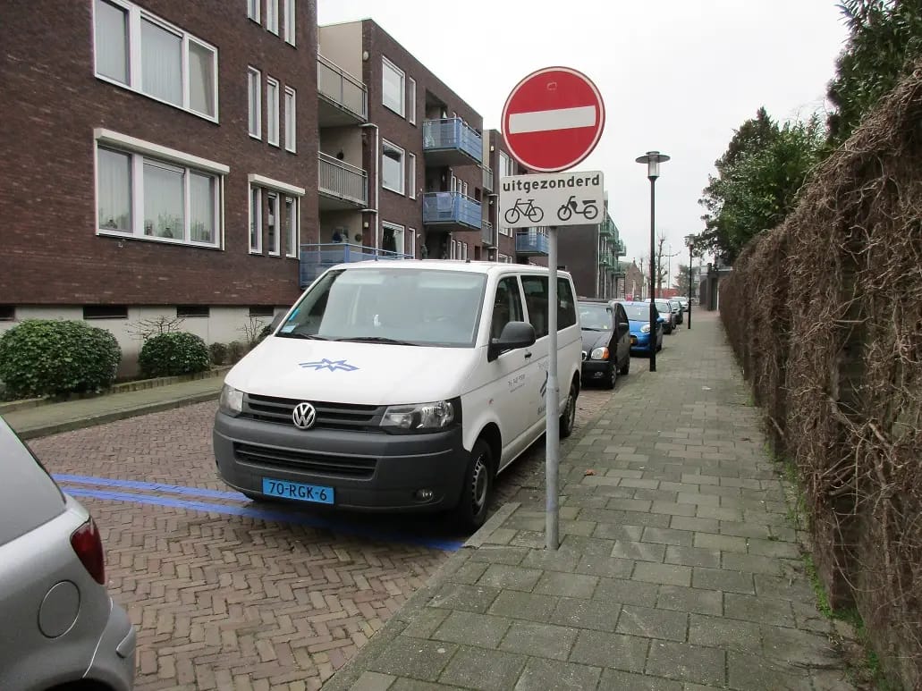 Volkswagen Transporter taxi van parked at the curb
