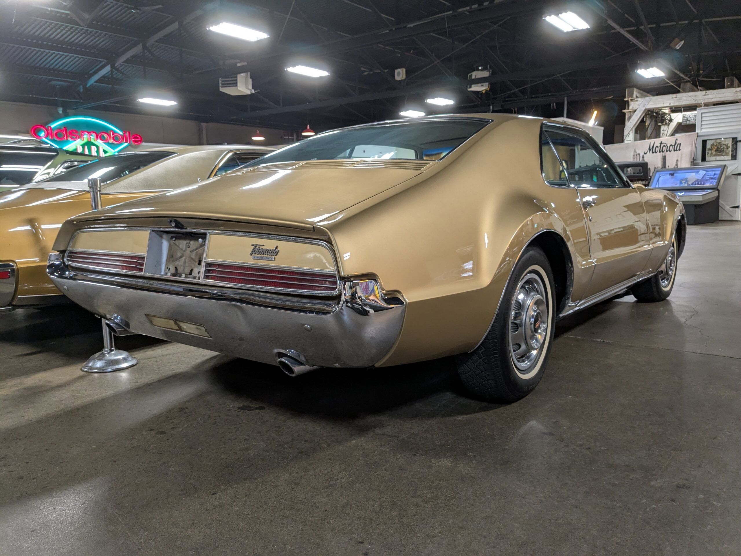 1966 Oldsmobile Toronados In (Almost) Every Color: A Masterpiece In Any Tone 6 Image of Trumpet Gold 1966 Oldsmobile Toronado in rear three-quarter passenger view at the R.E. Olds Museum in Lansing, Michigan