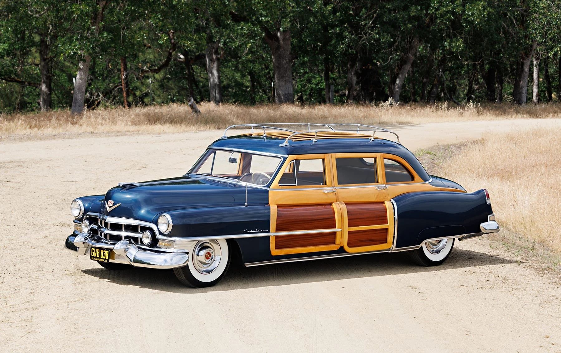 A Cadillac Woodie Sedan? This Wood-Paneled 1951 Cadillac Series 75 Was Once Owned By Gene Autry 1 High-angle left front 3q of an Empress Blue 1951 Cadillac Series 75 with wood doors and side window frames