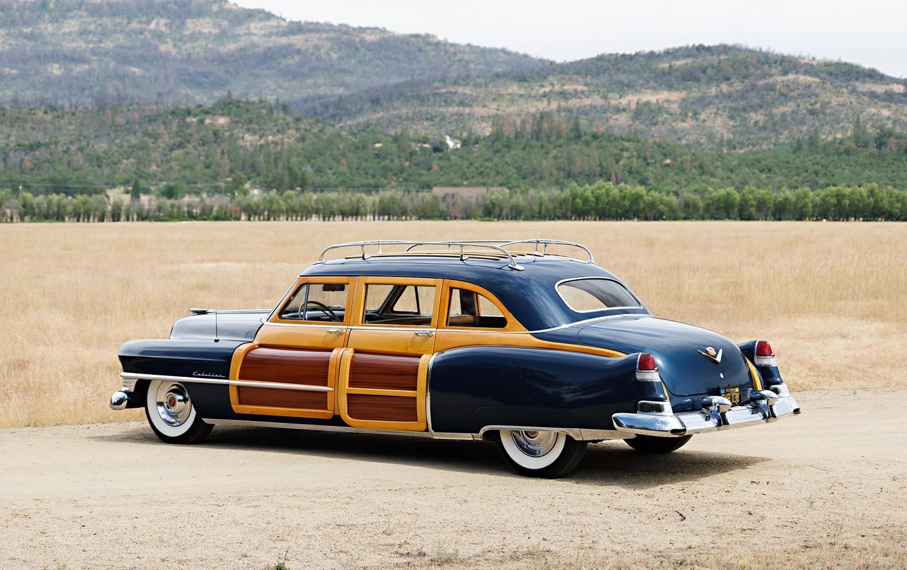 A Cadillac Woodie Sedan? This Wood-Paneled 1951 Cadillac Series 75 Was Once Owned By Gene Autry 17 Left rear 3q view of a blue 1951 Series 75 with wood doors and side window frames