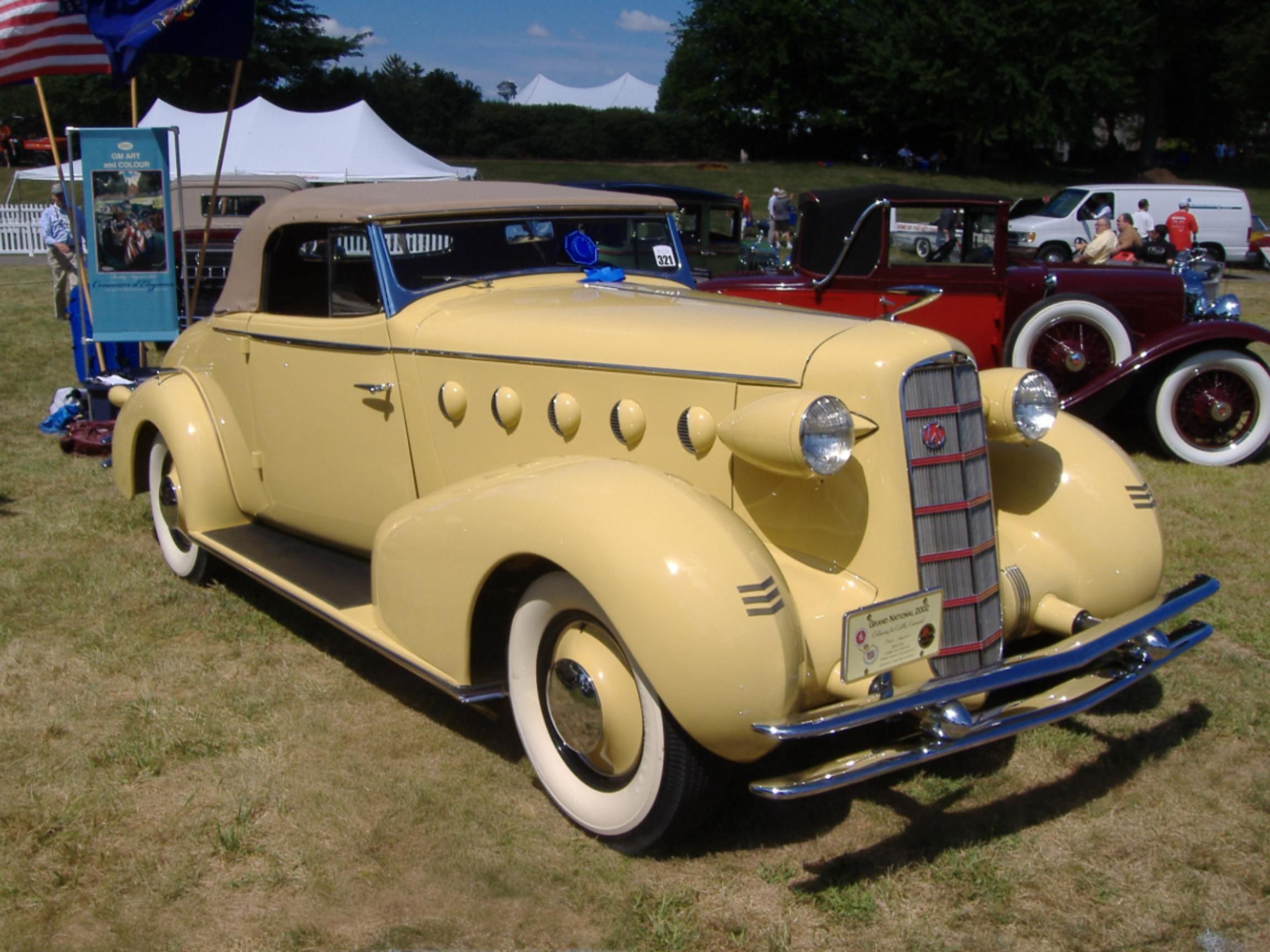 Grand Theft Auto: Four Examples Of American Design Forgery From The Big Three And Beyond 2 Picture of a yellow 1934 LaSalle Convertible Coupe on a showfield