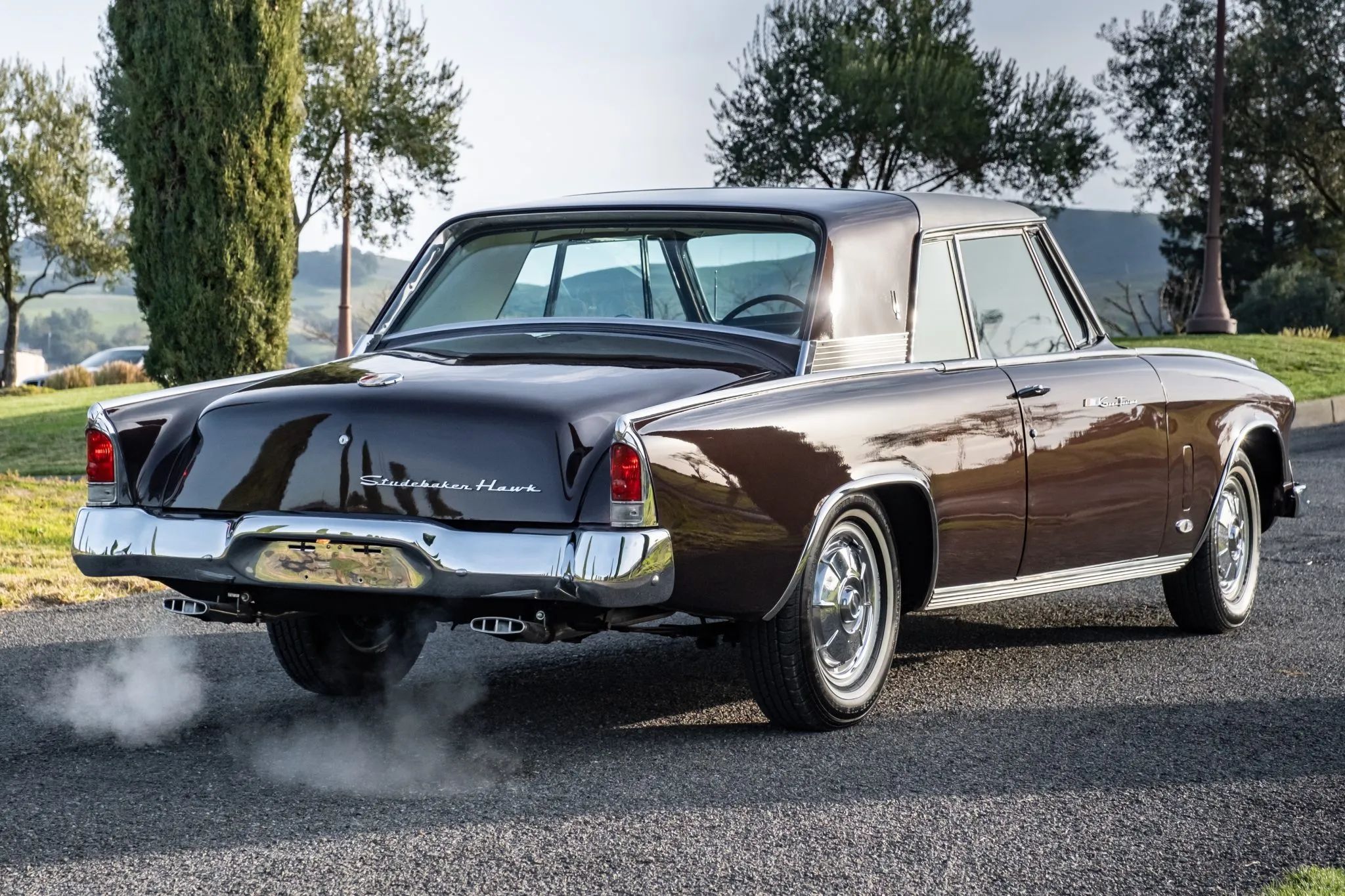 Studebaker Hawk: How Studebaker Made A Mess Of This Raymond Loewy Classic, And How Brooks Stevens Brought It Back 54 Right 3q view of a 1964 Studebaker GT Hawk with steam coming out of its tailpipes