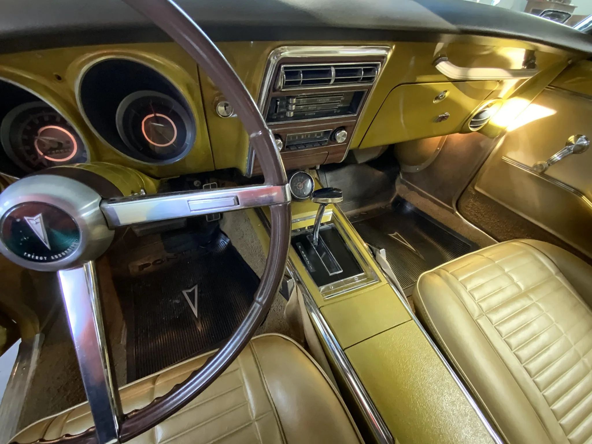 Dash and center console of a 1967 Firebird with an automatic floor shifter in a center console