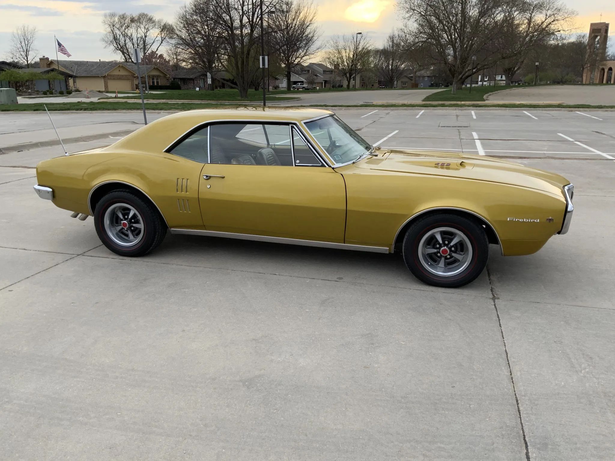 Right side view of a gold 1967 Firebird hardtop