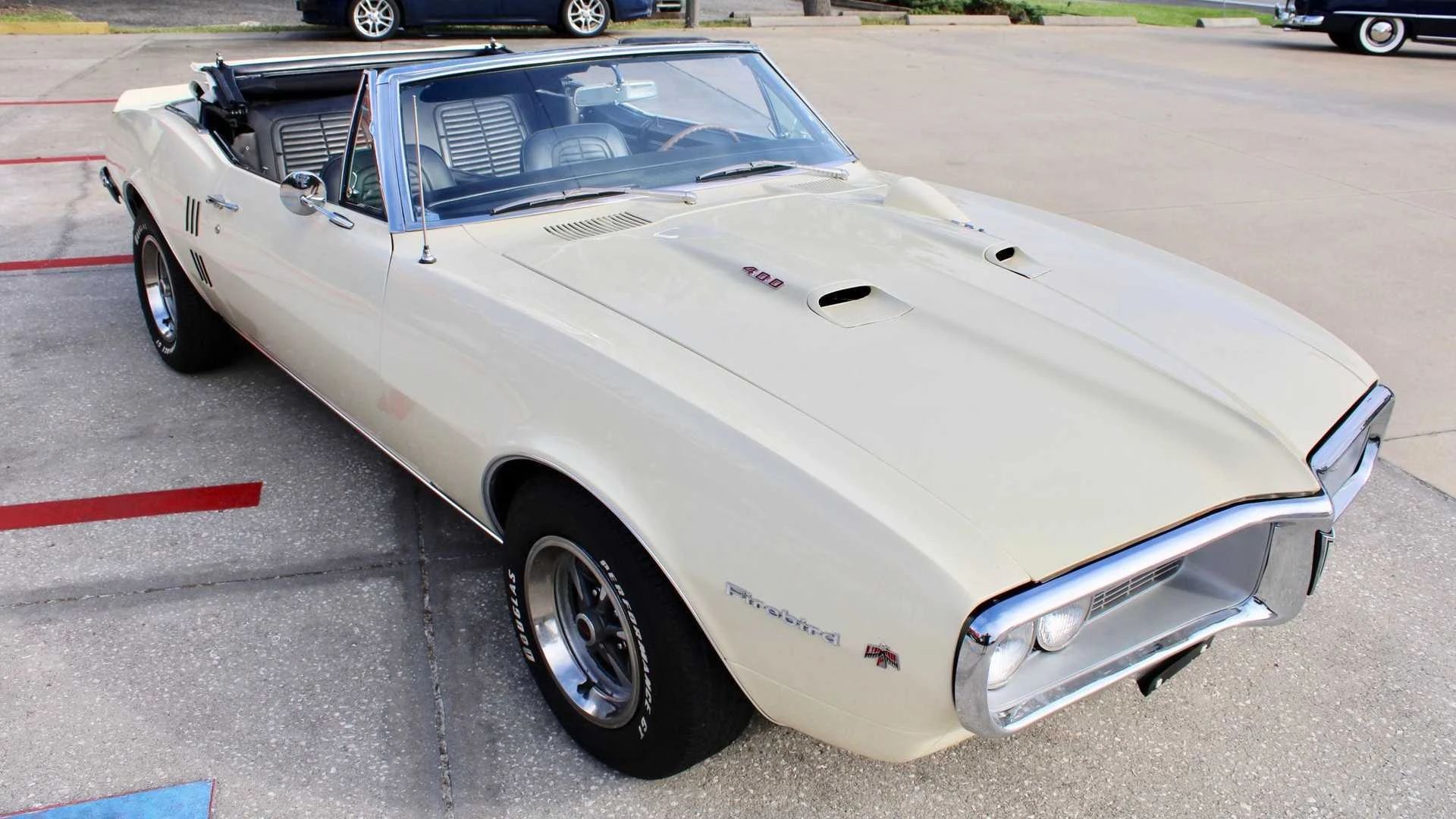 Right front 3q view of a cream 1967 Firebird convertible with the top down