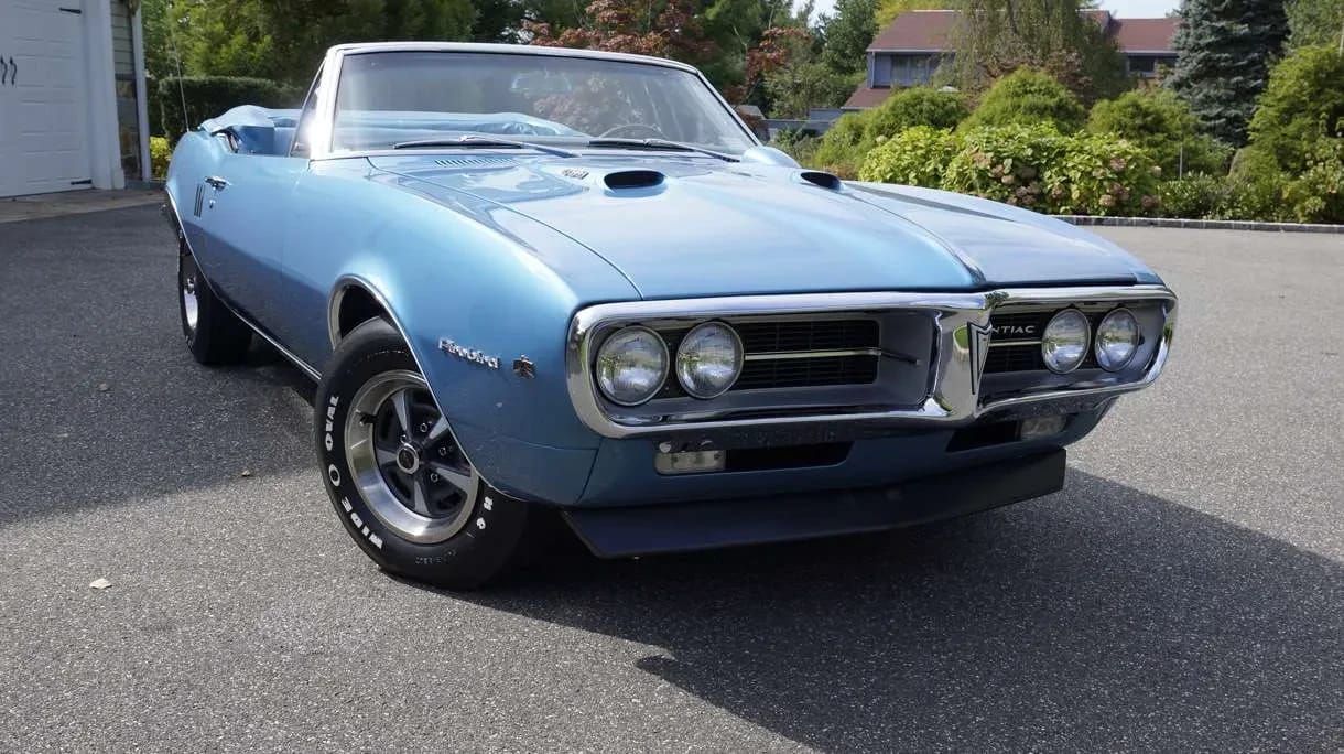 Right front 3q view of a blue 1967 Firebird convertible with the top down