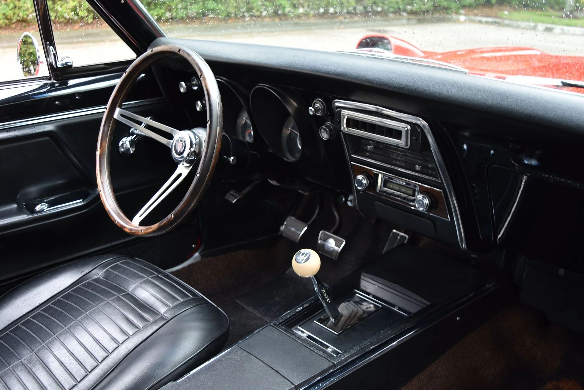1967 Pontiac Firebird Sprint OHC Versus Firebird 400 (Vintage Car Life Comparison): Overhead Cam Versus Cubic Inches 12 Right side of the dashboard of a 1967 Firebird with black vinyl upholstery