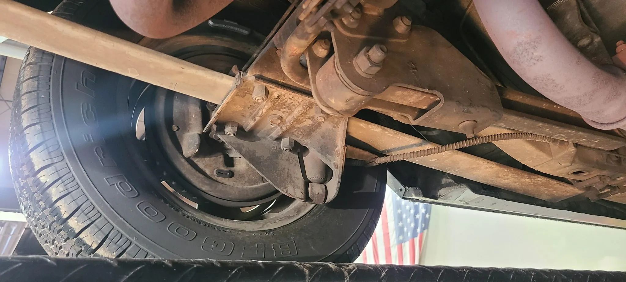 1967 Pontiac Firebird Sprint OHC Versus Firebird 400 (Vintage Car Life Comparison): Overhead Cam Versus Cubic Inches 23 Left side of the rear axle of a 1967 Firebird with traction bars