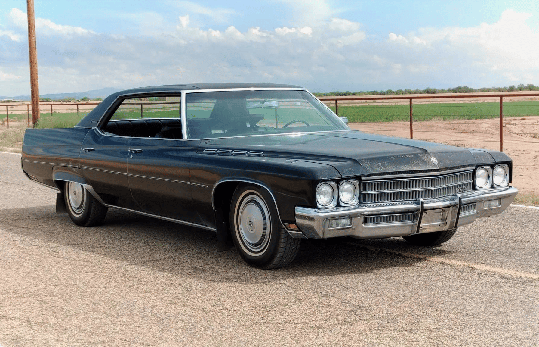 Grand Theft Auto: Four Examples Of American Design Forgery From The Big Three And Beyond 9 Image of a black 1971 Buick Electra 225 in front of a dusty field