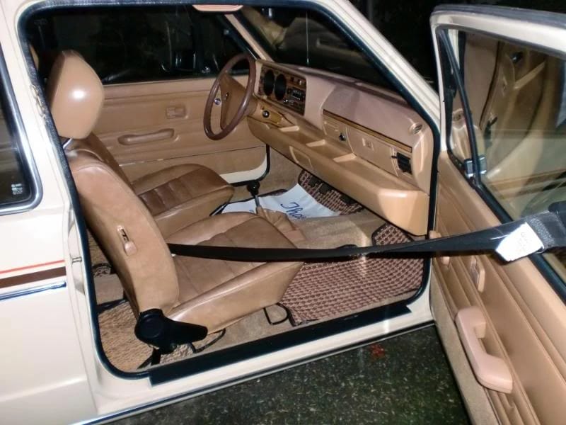 Volkswagen Automatic Seatbelt System: VW First Offered These Door-Mounted Passive Restraints Back In 1975 10 Front seats of a 1980 Volkswagen Rabbit with door-mounted seatbelt buckled, seen through the passenger door