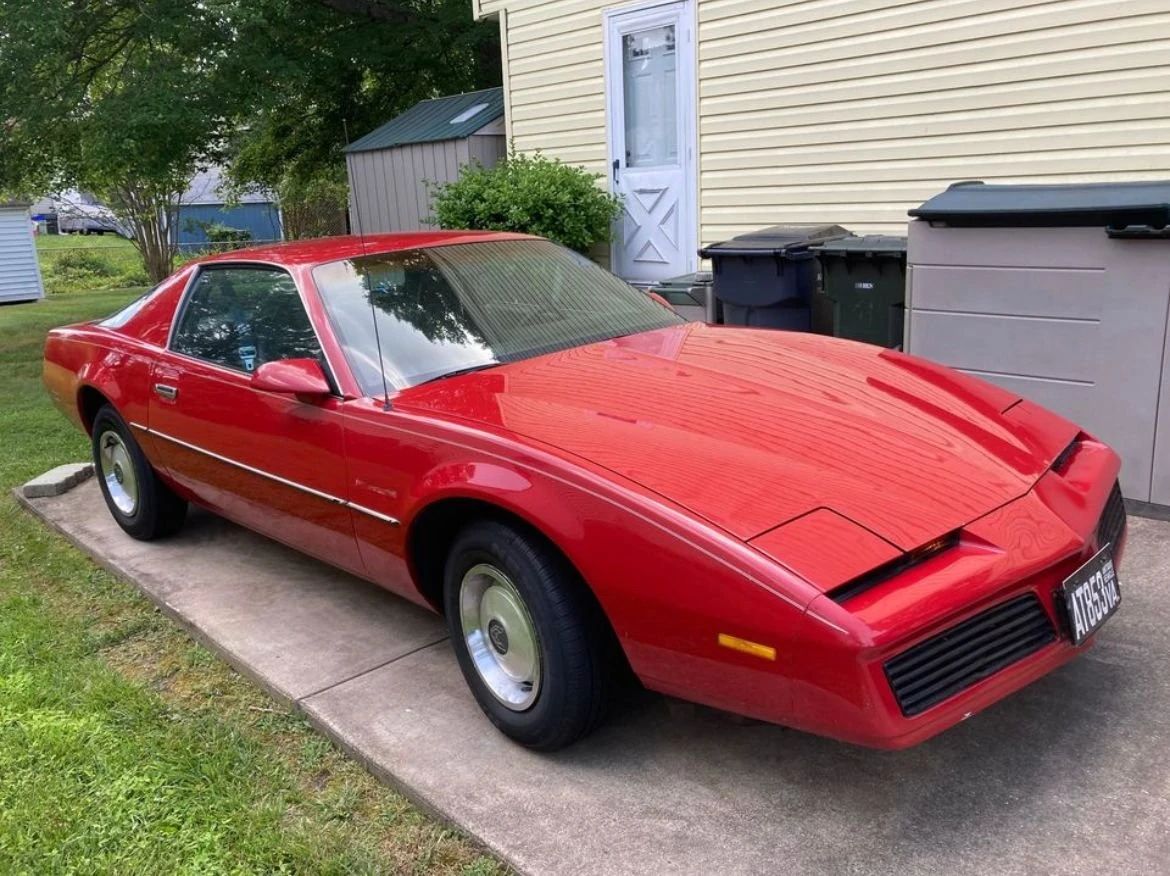 1982 Pontiac Firebird With The 2.5L Iron Duke Four: There's No Fire In This 'Bird 1 Right front 3q view of a Bright Red 1982 Pontiac Firebird with steel wheels