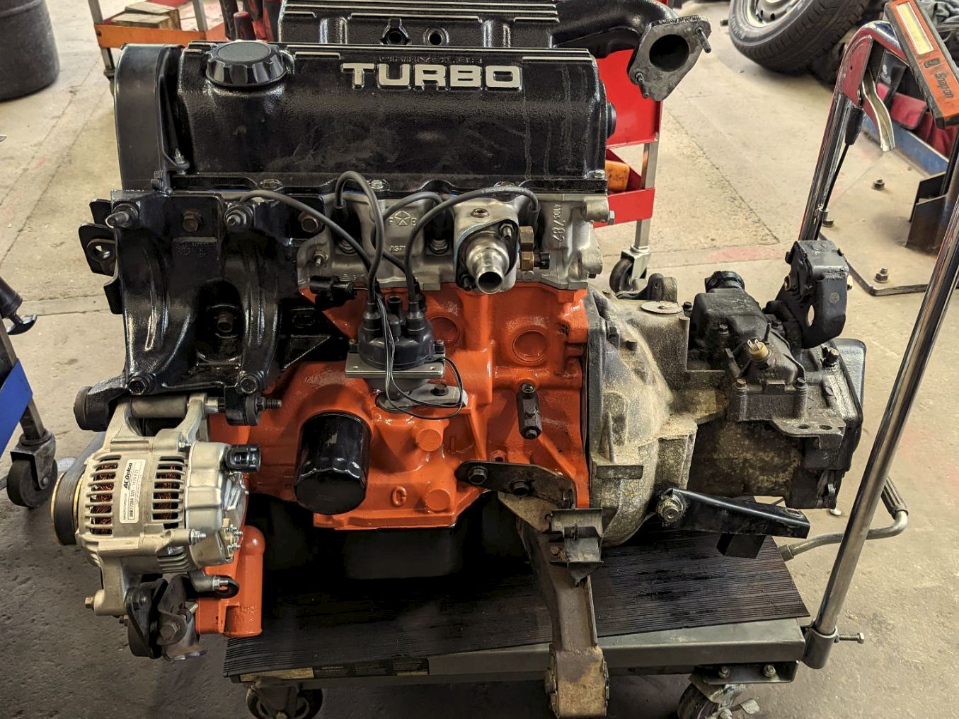 1989 Dodge Caravan Turbo and 1990 Plymouth Voyager Turbo: Rare Turbocharged Four-Cylinder Chrysler Minivans 11 Complete Chrysler Turbo I sitting on a shop floor