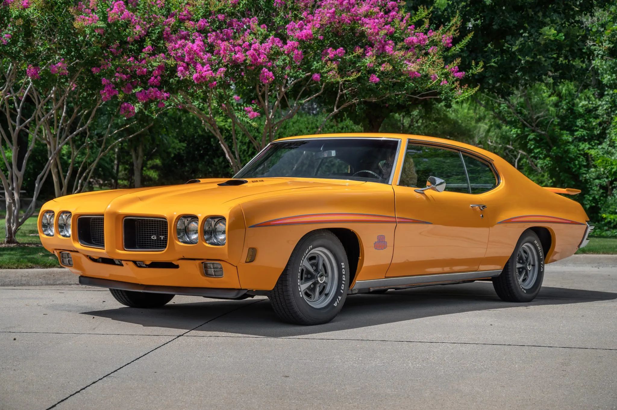Front three-quarter image of Orbit Orange 1970 Pontiac GTO