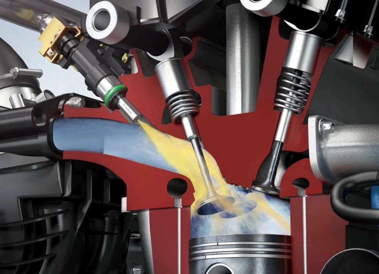 Why Gasoline Has Detergent Additives, And Why More Detergent ISN'T Necessarily Better 15 Cutaway illustration showing the spray of fuel from a port fuel injector