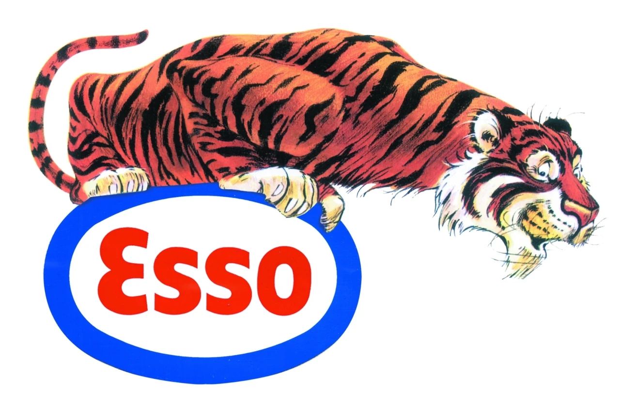 Illustration of a cartoon tiger perched atop an Esso logo