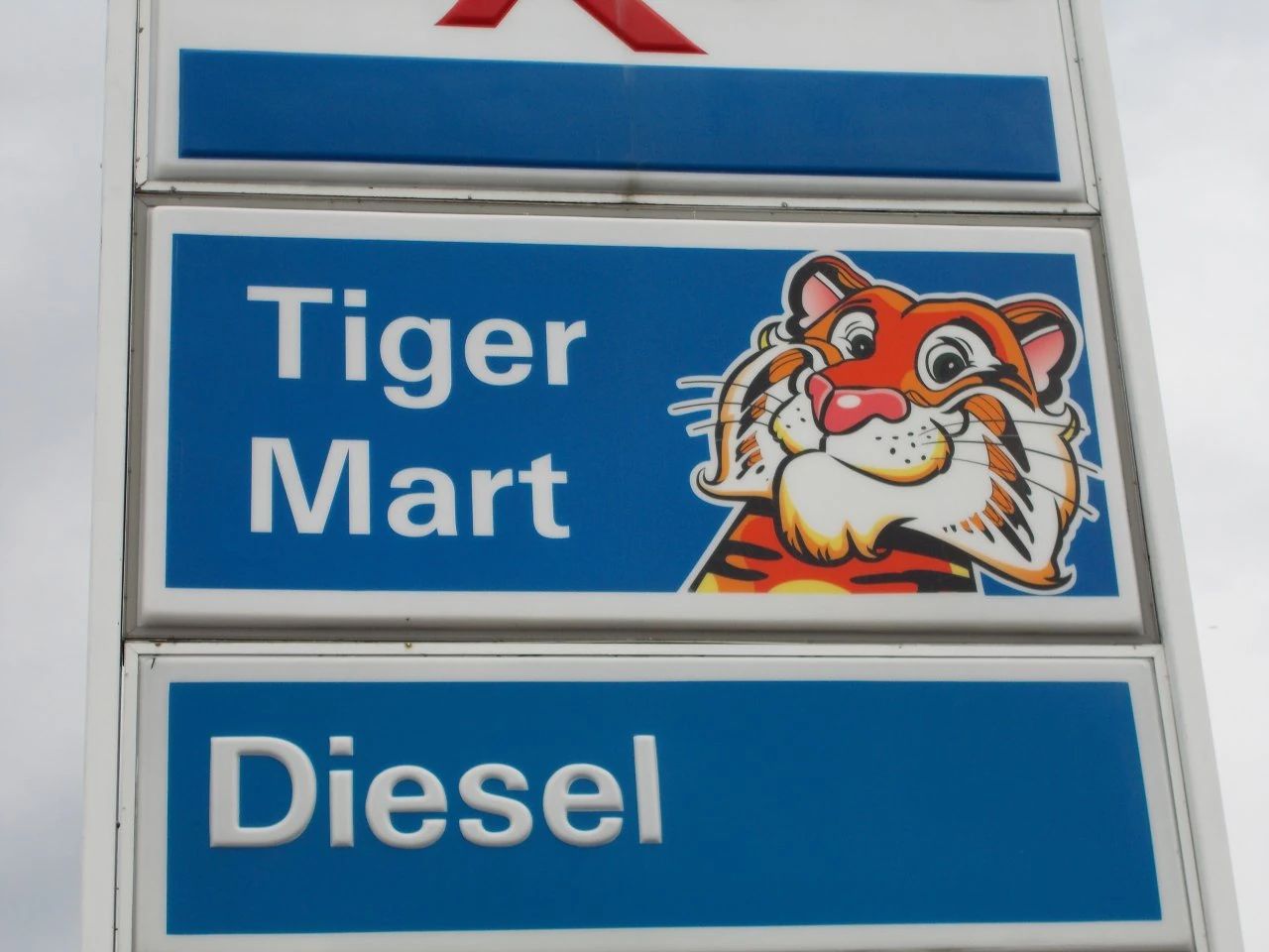 Photo of an Exxon sign showing the Tiger Mart logo