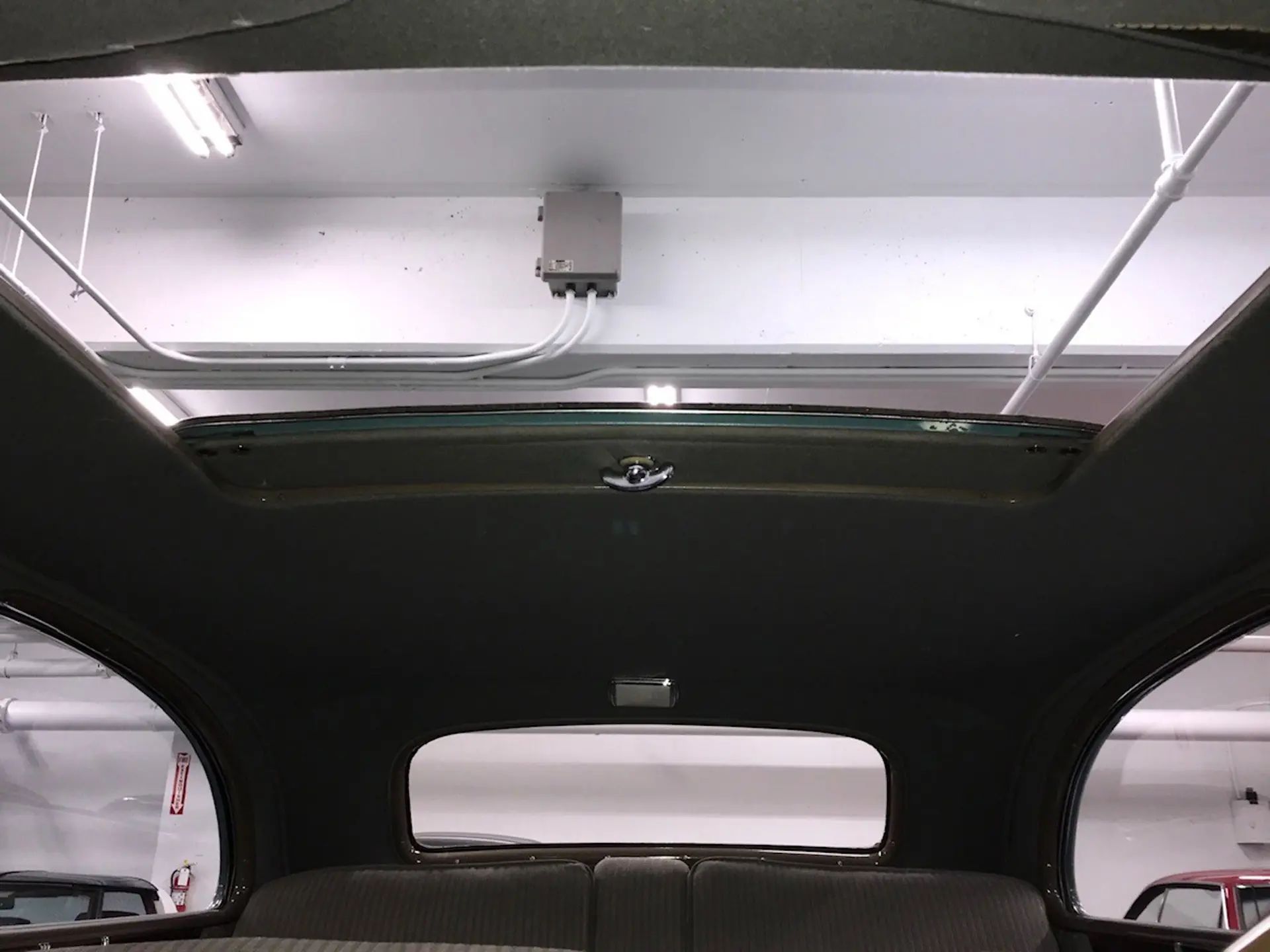 Open Sunshine Turret Top roof opening, seen from inside the car looking up and back