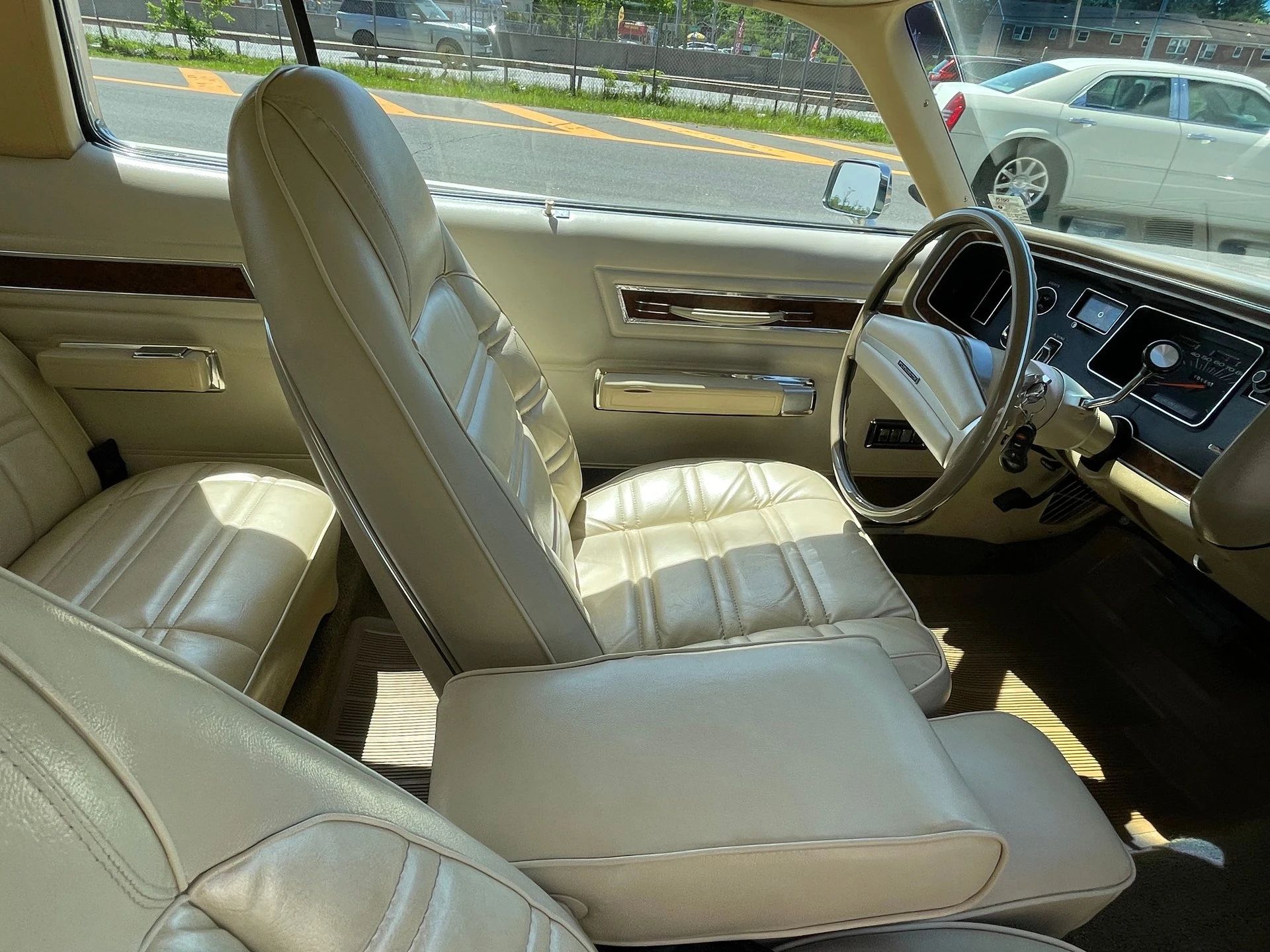Buckets and center armrest in a 1973 Plymouth C-body hardtop